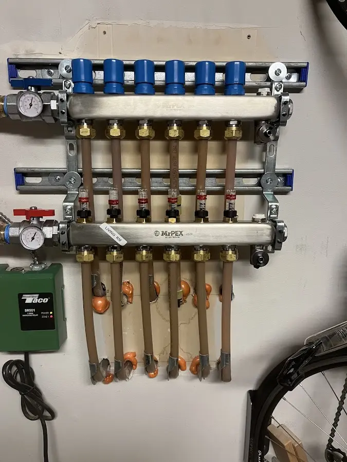 Plumber performing Water Heater Repair at a residential property in Elmwood